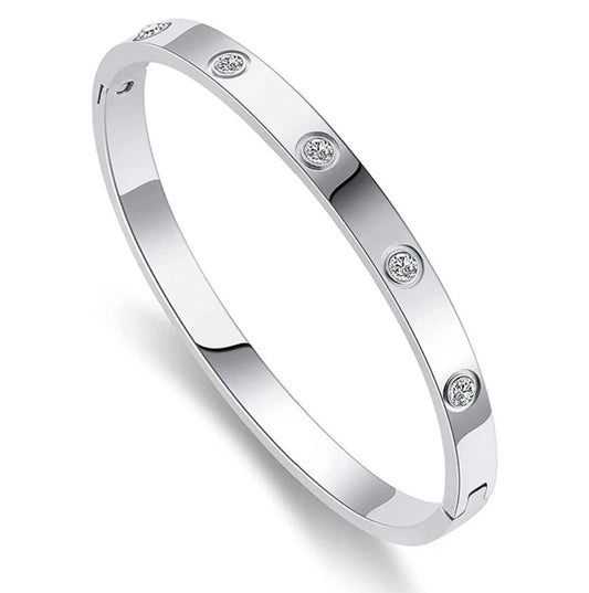 Silver American diamond bracelet with anti-tarnish finish.
Minimal silver-plated bangle with studs.
silver studded bracelet for women.
Elegant women’s silver bracelet.
Slayink Bracelet, silver bangle