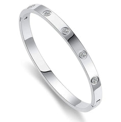 Silver American diamond bracelet with anti-tarnish finish.
Minimal silver-plated bangle with studs.
silver studded bracelet for women.
Elegant women’s silver bracelet.
Slayink Bracelet, silver bangle