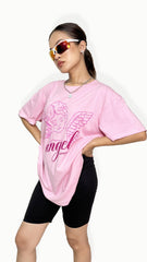 Women wearing pink oversized graphic printed cotton t-shirt,oversized t-shirt women, graphic print t-shirt women, pink oversized t-shirt, cotton oversized t-shirt for women, trendy graphic tee oversized, aesthetic graphic oversized t-shirt, loose fit pink graphic tee, pure cotton oversized t-shirt women, casual pink t-shirt for women,