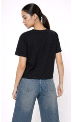 Person wearing a black t-shirt with 'ANGEL' text and blue jeans on a white background,Slayink Women Angel Graphic black tshirt,black t-shirt women, printed t-shirt women, graphic print black tee. casual wear, cute gahic tshirt , black top, loose tshirt womens, womens print tshirt, printed gym t-shirt women, college wear tshirt, relaxed fit t-shirt , women workout tshirt