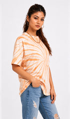 Woman wearing a tie-dye shirt and ripped jeans on a white background.Tie & dye t-shirt, women t-shirt, cotton t-shirt, casual outfit, trending t-shirt, Slayink orange tie & dye t-shirt, Slayink women tie & dye t-shirt, orange tie dye t-shirt women, oversized t-shirt , cotton t-shirt for women, summer t-shirt women, college wear t-shirt for girls, beach wear t-shirt women, gym wear t-shirt women, trendy college wear, pastel top, women's workout t-shirt, gym t-shirt women, ladies top, cotton t-shirt, trendy
