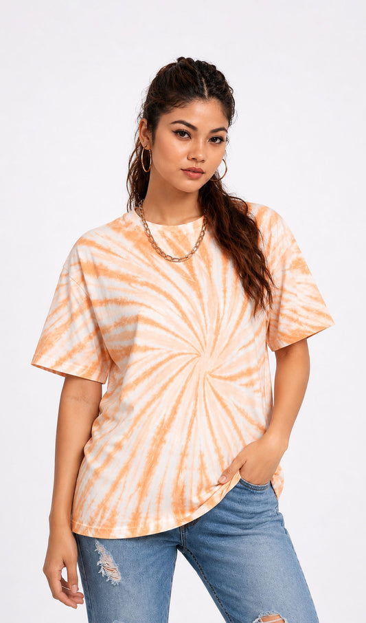 Woman wearing a tie-dye shirt and ripped jeans on a white background.Tie & dye t-shirt, women t-shirt, cotton t-shirt, casual outfit, trending t-shirt, Slayink orange tie & dye t-shirt, Slayink women tie & dye t-shirt, orange tie dye t-shirt women, oversized t-shirt , cotton t-shirt for women, summer t-shirt women, college wear t-shirt for girls, beach wear t-shirt women, gym wear t-shirt women, trendy college wear, pastel top, women's workout t-shirt, gym t-shirt women, ladies top, cotton t-shirt, trendy