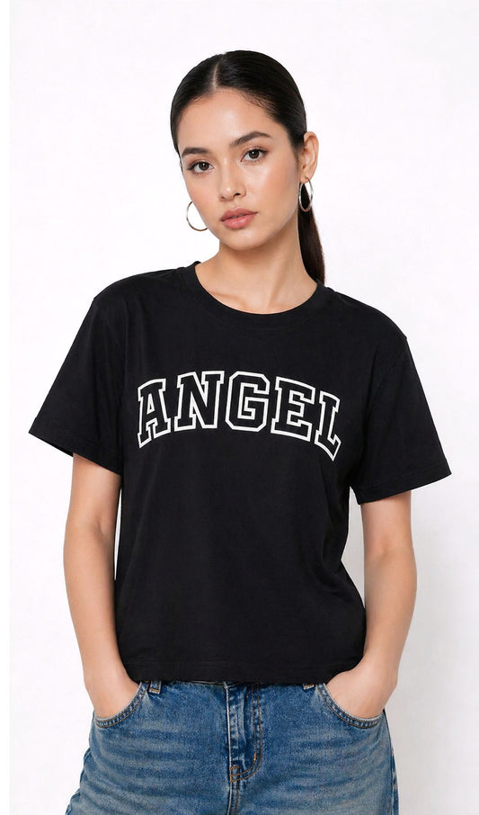 Person wearing a black t-shirt with 'ANGEL' text and blue jeans on a white background,Slayink Women  Angel Graphic black tshirt,black t-shirt women, printed t-shirt women, graphic print black tee. casual wear, cute gahic tshirt , black top, loose tshirt womens,  womens print tshirt, printed gym t-shirt women, college wear tshirt, relaxed fit t-shirt , women workout tshirt
