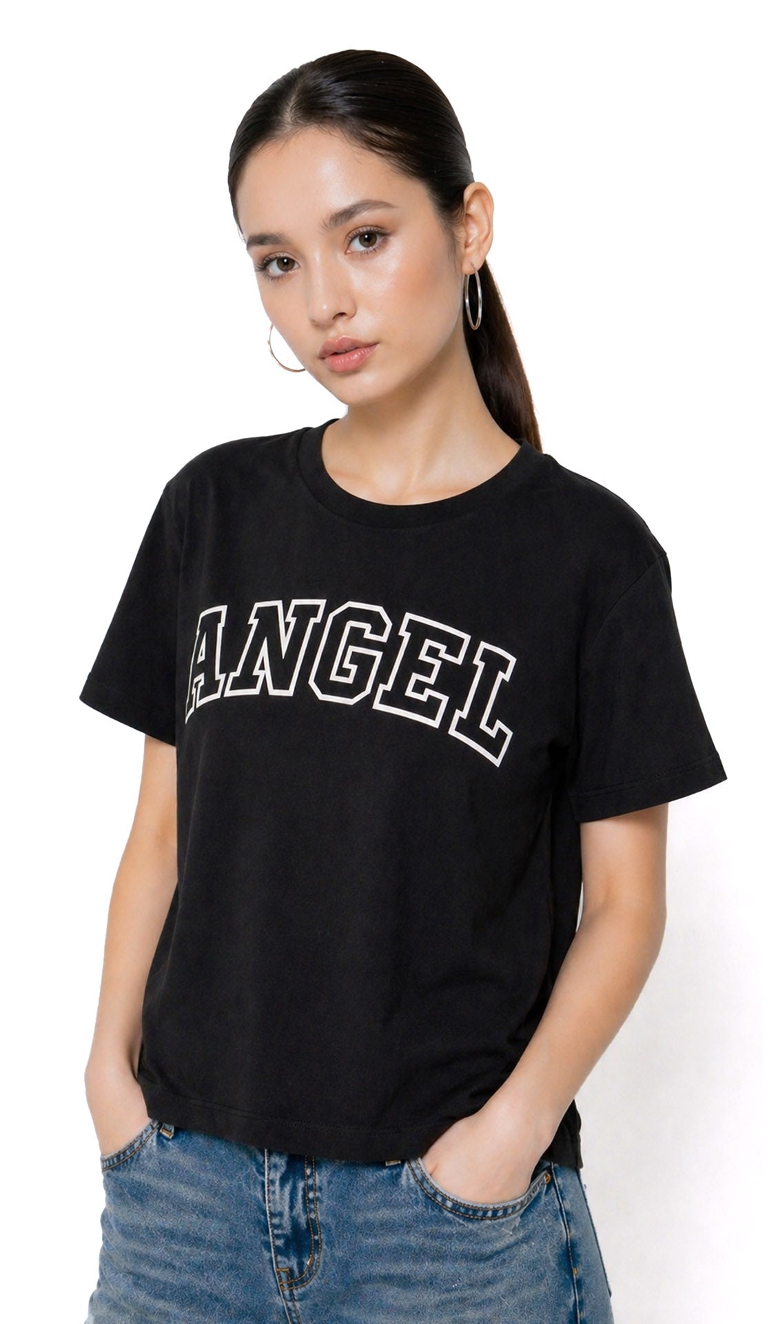 Person wearing a black t-shirt with 'ANGEL' text and blue jeans on a white background,Slayink Women  Angel Graphic black tshirt,black t-shirt women, printed t-shirt women, graphic print black tee. casual wear, cute gahic tshirt , black top, loose tshirt womens,  womens print tshirt, printed gym t-shirt women, college wear tshirt, relaxed fit t-shirt , women workout tshirt