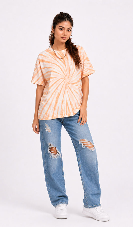 Woman wearing a tie-dye shirt and ripped jeans on a white background.Tie & dye t-shirt, women t-shirt, cotton t-shirt, casual outfit, trending t-shirt, Slayink orange tie & dye t-shirt, Slayink  women tie & dye t-shirt, orange tie dye t-shirt women, oversized t-shirt , cotton t-shirt for women, summer t-shirt women, college wear t-shirt for girls, beach wear t-shirt women, gym wear t-shirt women,  trendy college wear, pastel top, women's workout t-shirt, gym t-shirt women, ladies top, cotton t-shirt, trendy