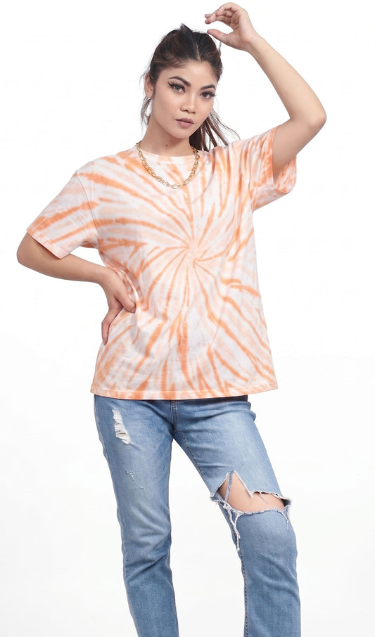 Woman wearing a tie-dye shirt and ripped jeans on a white background.Tie & dye t-shirt, women t-shirt, cotton t-shirt, casual outfit, trending t-shirt, Slayink orange tie & dye t-shirt, Slayink  women tie & dye t-shirt, orange tie dye t-shirt women, oversized t-shirt , cotton t-shirt for women, summer t-shirt women, college wear t-shirt for girls, beach wear t-shirt women, gym wear t-shirt women,  trendy college wear, pastel top, women's workout t-shirt, gym t-shirt women, ladies top, cotton t-shirt, trendy
