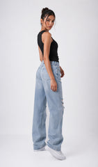 Woman wearing light blue jeans and a black sleeveless top on a white background.black tank top, black tank top women, women's black tank top, black sleeveless top, black camisole top, black vest top women, black summer top, basic black tank top, fitted black tank top, ribbed black tank top, casual black top, trendy black tank top, women's fashion top, black top for women, ladies black top, stylish black tank top, black crop tank top, everyday tank top, minimalist fashion, casual women's wear, summer fashion