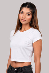 Woman wearing a white crop top against a plain background.white crop top, white crop top women, women's white crop top, white top for women, white cropped top, trendy white crop top, stylish white top, casual white crop top, summer crop top, fitted crop top, basic white crop top, sleeveless crop top, women's fashion top, ladies white top, fashion crop top, chic white crop top, minimalist fashion, aesthetic outfit, casual women's wear, trendy women's clothing, summer fashion women, everyday outfit.