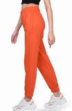 Orange joggers,orange high waisted cotton joggers, high waisted joggers, casual wear joggers, comfortable joggers, breathable joggers, stylish joggers, women's joggers, versatile joggers, premium joggers