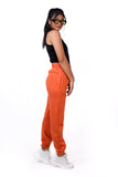 Orange joggers,orange high waisted cotton joggers, high waisted joggers, casual wear joggers, comfortable joggers, breathable joggers, stylish joggers, women's joggers, versatile joggers, premium joggers